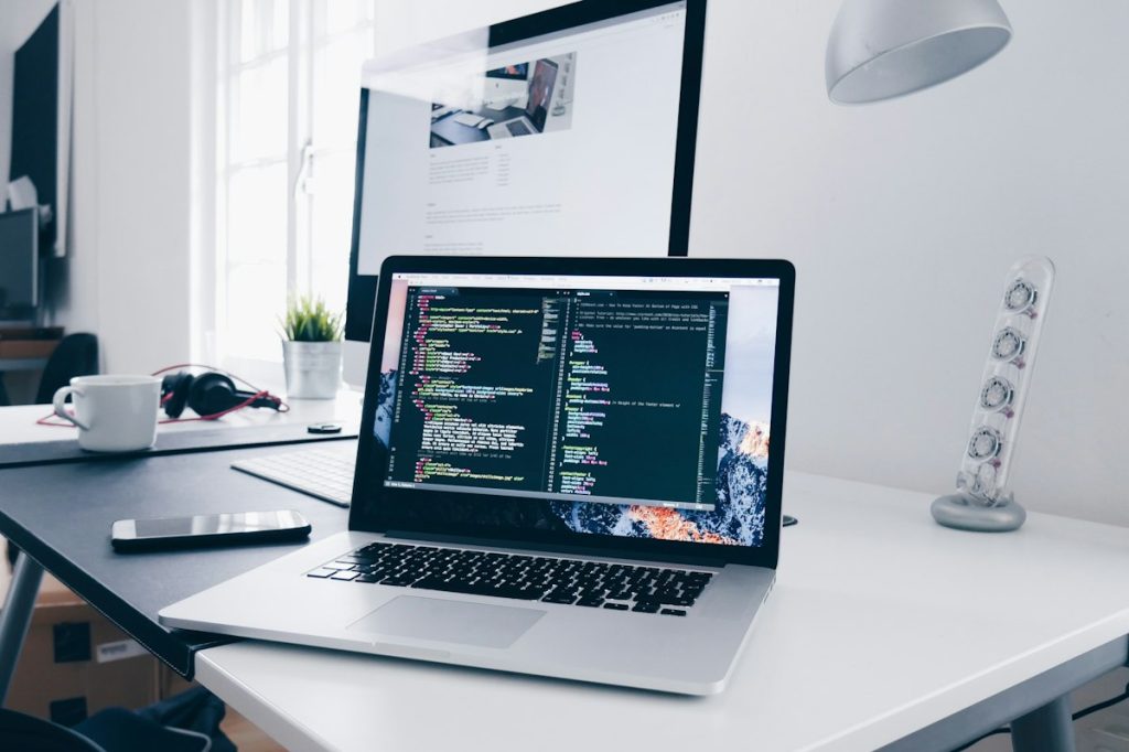 Web Developer Coding PHP and Laravel on Screen