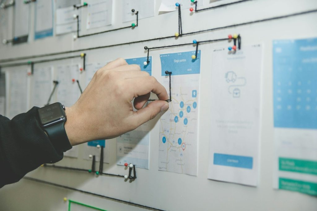 Design Wireframes and Flowcharts on Desk